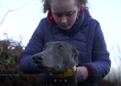 loving her greyhound